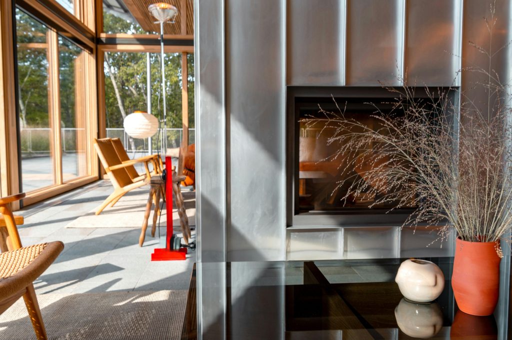 pexels-photo-9753831-9753831 Stylish living room interior in Catskill, NY featuring a fireplace, decor, and natural light.